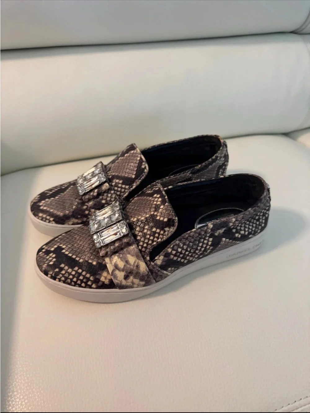 MICHAEL KORS SLIP-ON SNAKE PRINT SNEAKERS WITH GEM EMBELLISHMENT- BLACK/ aGRAY